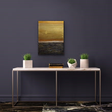 Load image into Gallery viewer, Studio Brambilla Aware Winning Toronto Artist: Home Decor: This pretty much depicts life don't you think. The sky is a beautiful gold but the seas are quite rough. The good and bad. The Yin and Yang. A thought provoking composition. I wanted to feel the roughness of the water so I used Venetian Plaster on a wood panel to get the rough texture and the sky is painted with high end metallic gold paint. If you look closely you'll see the sun breaking through...so there is a happy ending!