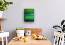 Load image into Gallery viewer, Studio Brambilla Aware Winning Toronto Artist: Home Decor: Want a cheerful painting that reminds you of Spring all the time? This colourfield painting is just for you! Beautiful shades of green surrounding blue water and a golden sunrise. Finished with shiny resin to make the colours pop, this will look great on dark or light coloured walls. This is 12"x16" acrylic on wood panel with wraparound painted sides making a frame unnecessary.