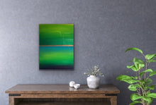 Load image into Gallery viewer, Studio Brambilla Aware Winning Toronto Artist: Home Decor: Want a cheerful painting that reminds you of Spring all the time? This colourfield painting is just for you! Beautiful shades of green surrounding blue water and a golden sunrise. Finished with shiny resin to make the colours pop, this will look great on dark or light coloured walls. This is 12"x16" acrylic on wood panel with wraparound painted sides making a frame unnecessary.