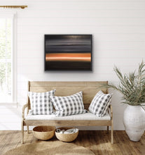 Load image into Gallery viewer, Studio Brambilla Aware Winning Toronto Artist: Home Decor: As you're dreaming, you see the light on the horizon surrounded by a bronze glow. The rest of the sky and water are black to dark grey and there is a cloud floating above... or is that an island in the sky? Relax. You are entering a peaceful place and looking forward to exploring the light. At 24"x30" this oil on canvas work is suitable for medium sized spaces finished smartly with a black floating frame.