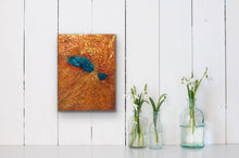Load image into Gallery viewer, Studio Brambilla Aware Winning Toronto Artist: Home Decor: This is part of my Topography Series. Imagine yourself flying over a mountain range that holds a beautiful blue embedded lake. This is taken from an image of such a place and it creates an amazingly colourful addition to your home as well as a great conversation piece. This is 12&quot;x16&quot; acrylic on Venetian Plaster (which creates the texture) and finished with shiny resin and wraparound painted sides so a frame is not necessary.
